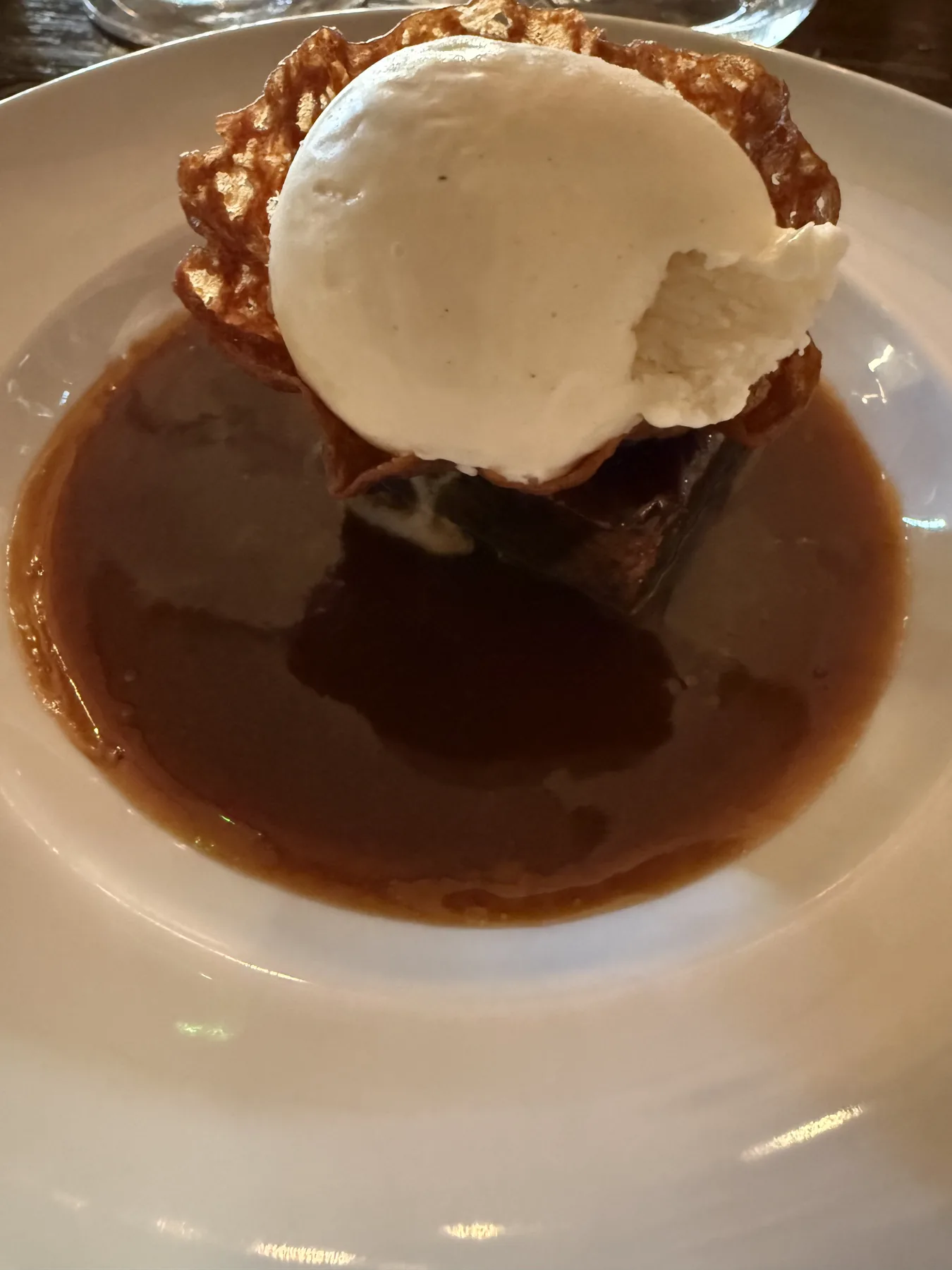 Warm pudding and cold vanilla ice cream.