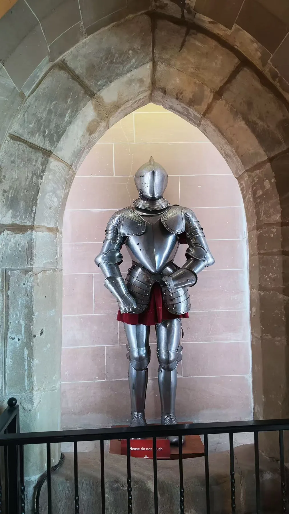 A suit of armour standing very quietly.